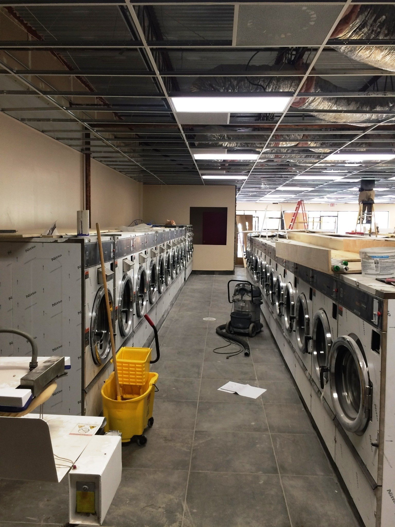 Completed coin laundry equipment room