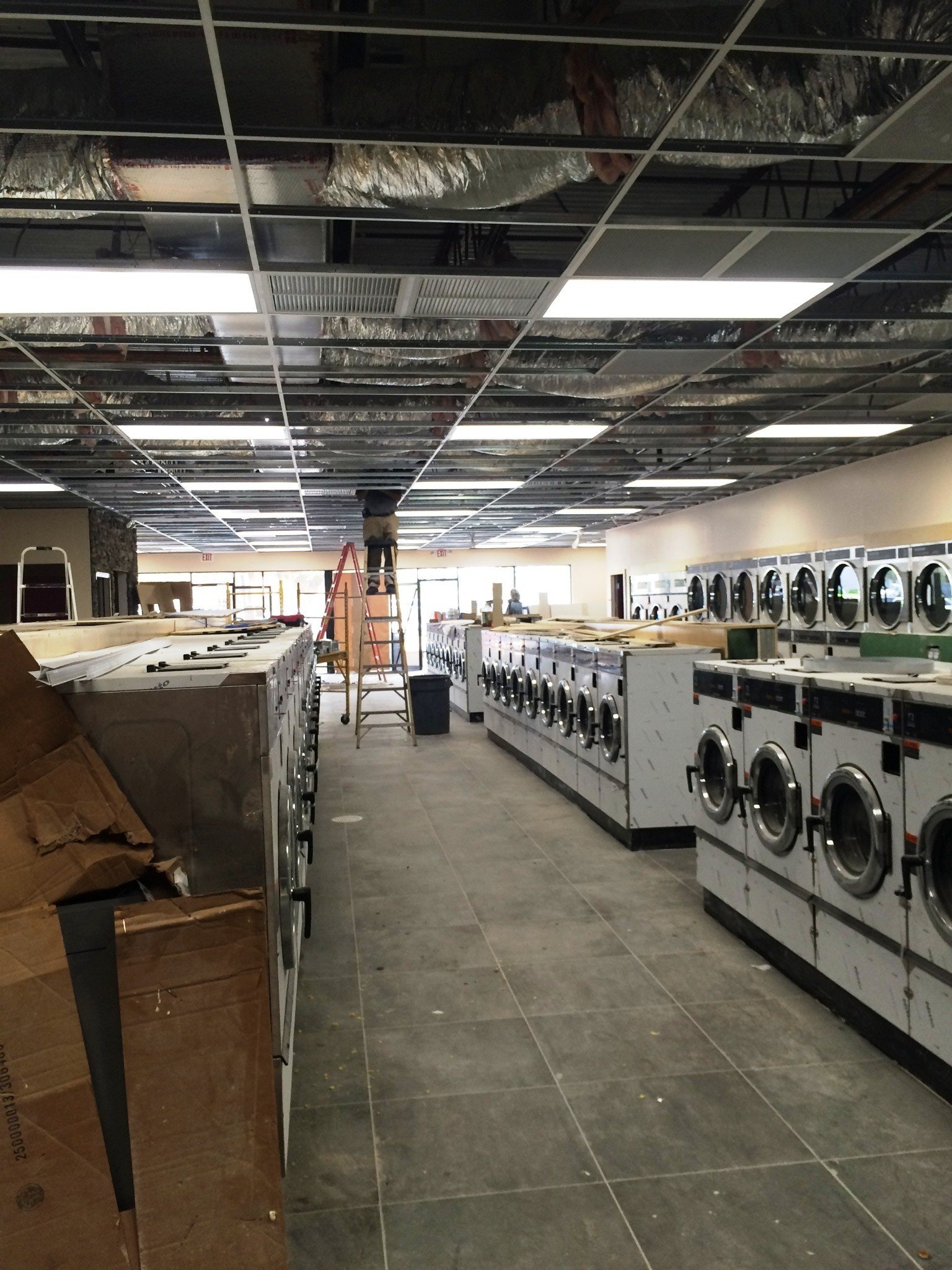 Rows of commercial washers and dryers