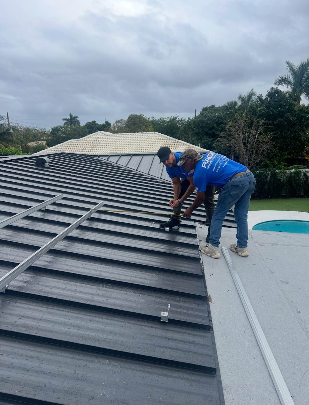 Real PALMA roofing crew performing metal roof field work